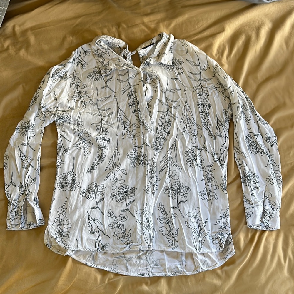 Button down shirt with a cute accent in the back